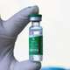 A health worker in Malaysia holds up a vial of Covishield, the version of AstraZeneca-Oxford’s Covid-19 coronavirus vaccine made in India